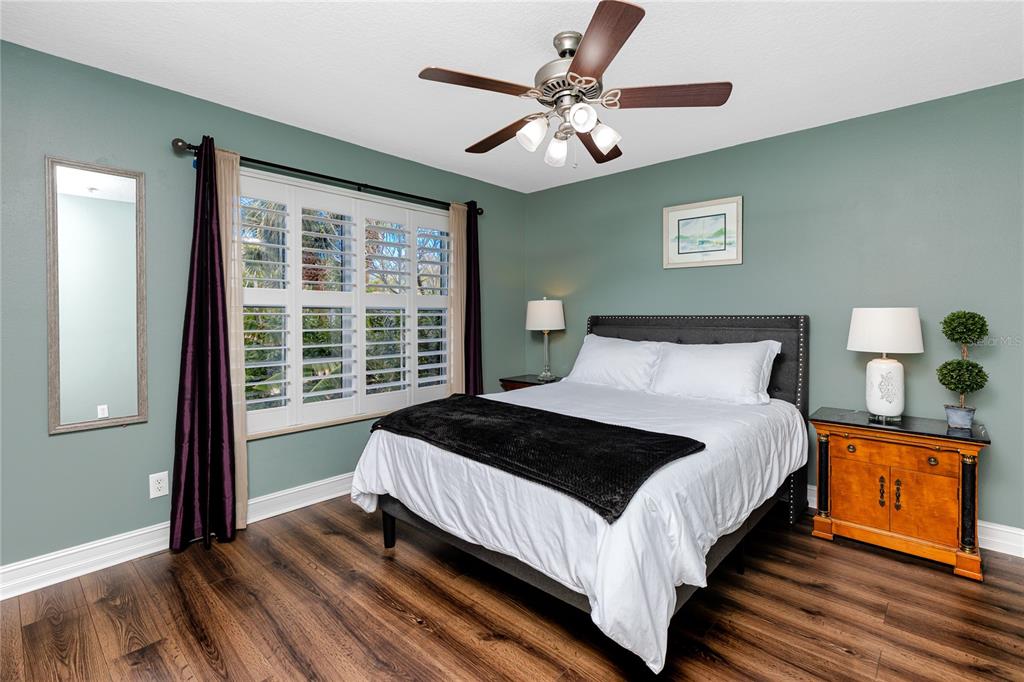 2601 Bay Boulevard Indian Rocks Beach, FL 33785 - Photo 24 of 64 a bedroom with a bed and a window