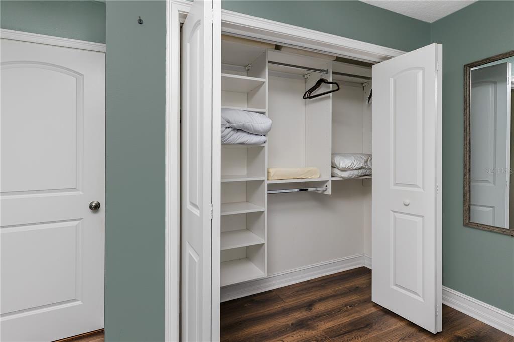 2601 Bay Boulevard Indian Rocks Beach, FL 33785 - Photo 25 of 64 a view of walk in closet with empty racks
