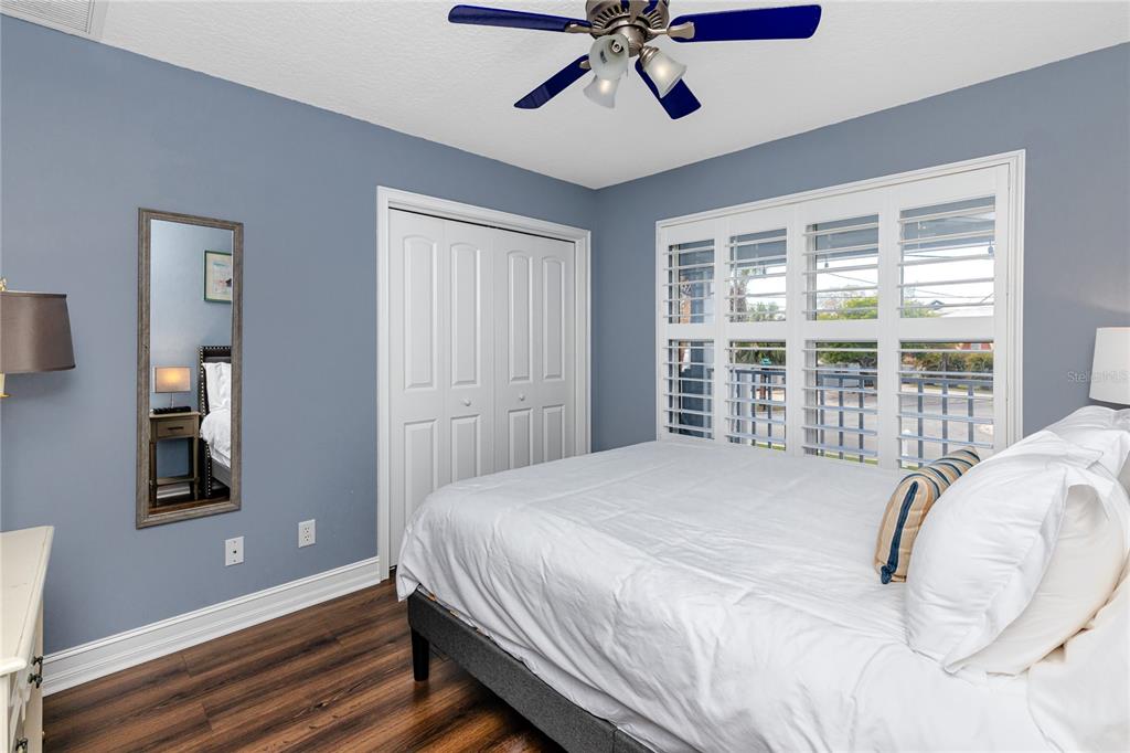 2601 Bay Boulevard Indian Rocks Beach, FL 33785 - Photo 28 of 64 a bedroom with a large bed and a window
