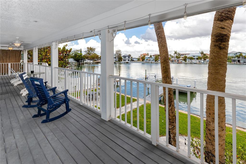 2601 Bay Boulevard Indian Rocks Beach, FL 33785 - Photo 3 of 64 a balcony with furniture and wooden floor