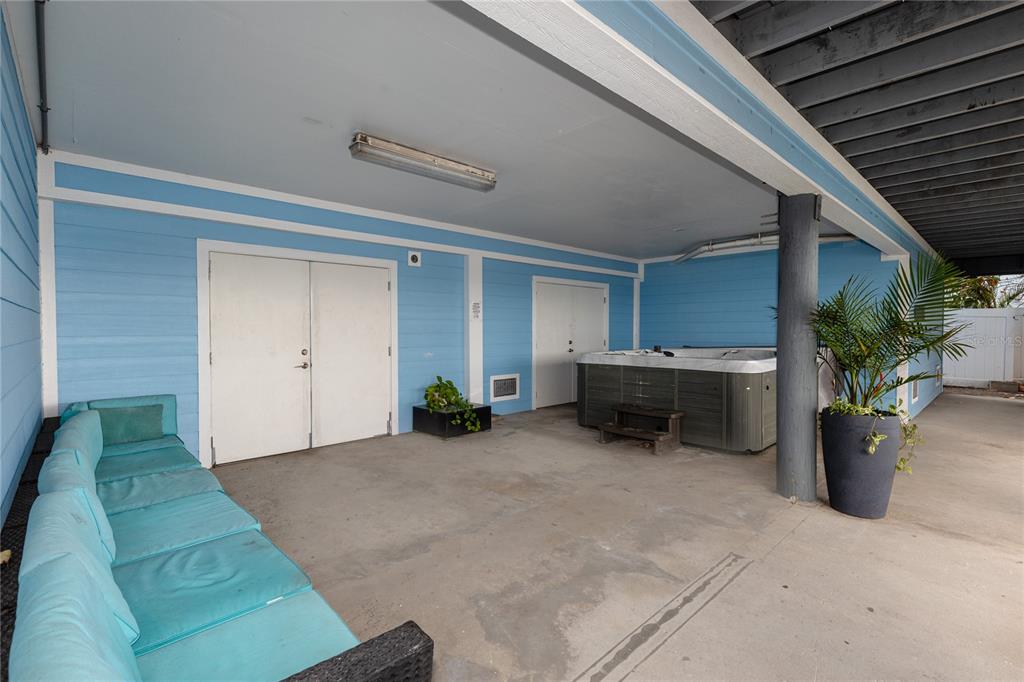 2601 Bay Boulevard Indian Rocks Beach, FL 33785 - Photo 32 of 64 a view of a porch with furniture and potted plants