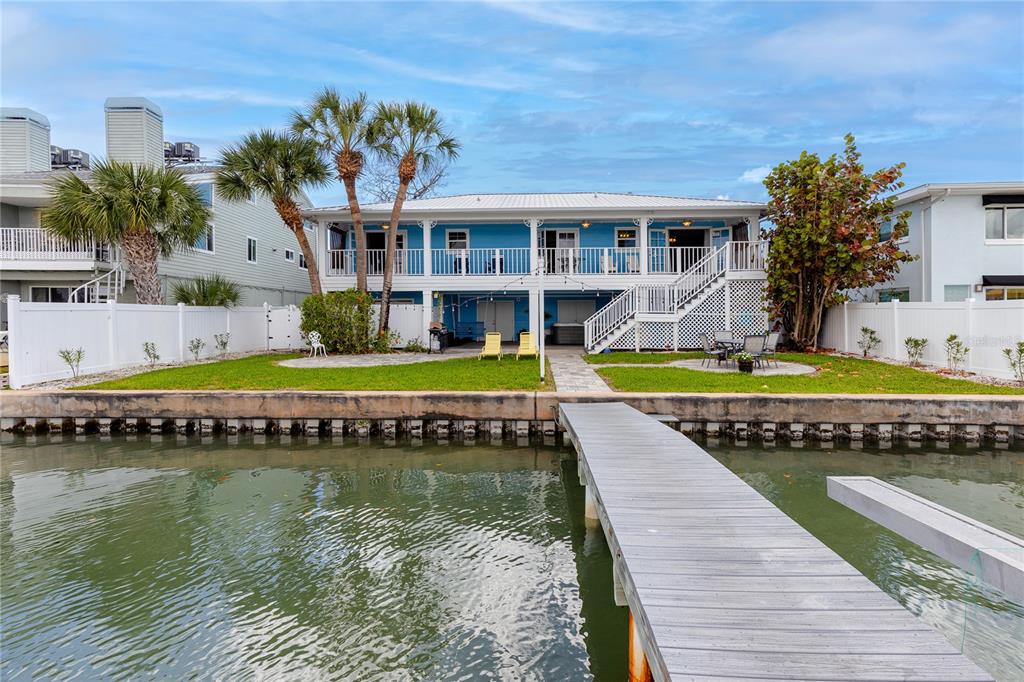 2601 Bay Boulevard Indian Rocks Beach, FL 33785 - Photo 39 of 64 a view of swimming pool with outdoor seating and yard