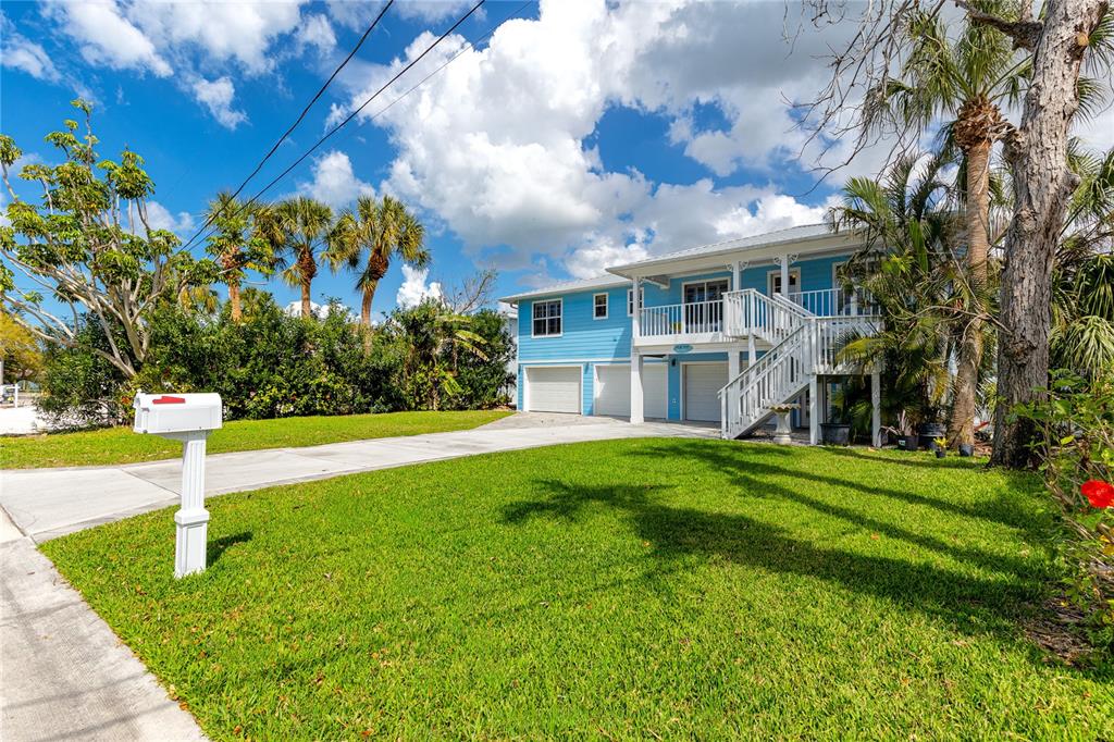 2601 Bay Boulevard Indian Rocks Beach, FL 33785 - Photo 59 of 64 a front view of a house with a yard
