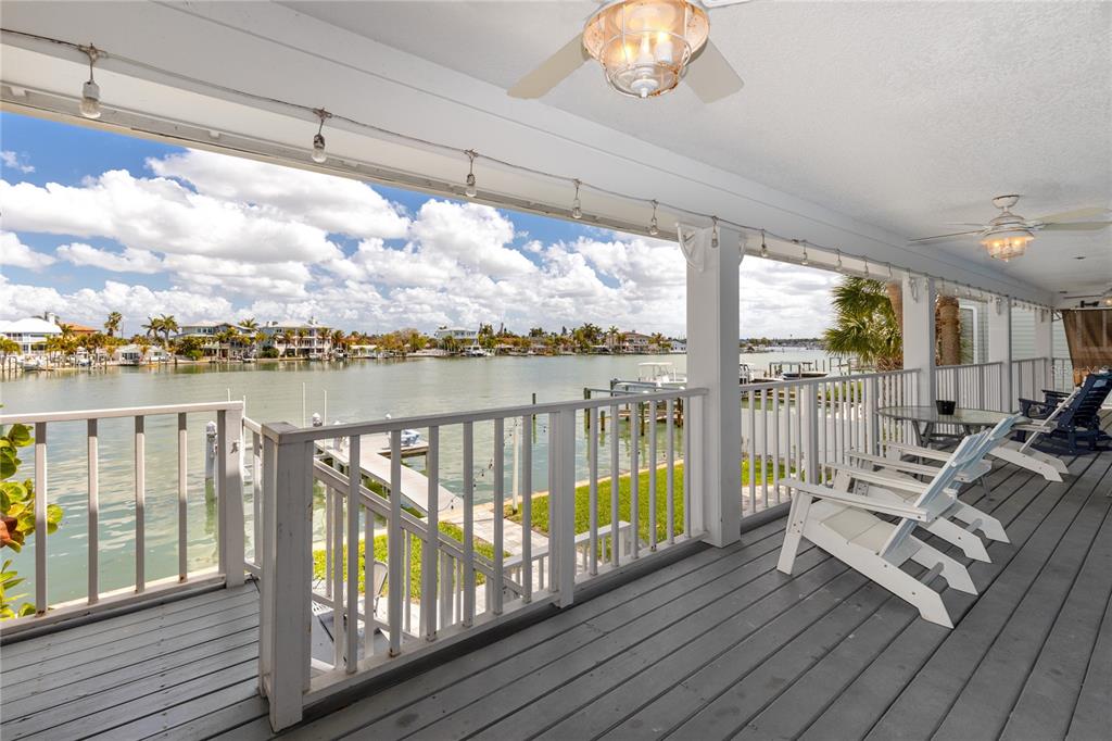 2601 Bay Boulevard Indian Rocks Beach, FL 33785 - Photo 64 of 64 a balcony with wooden floor and outdoor space