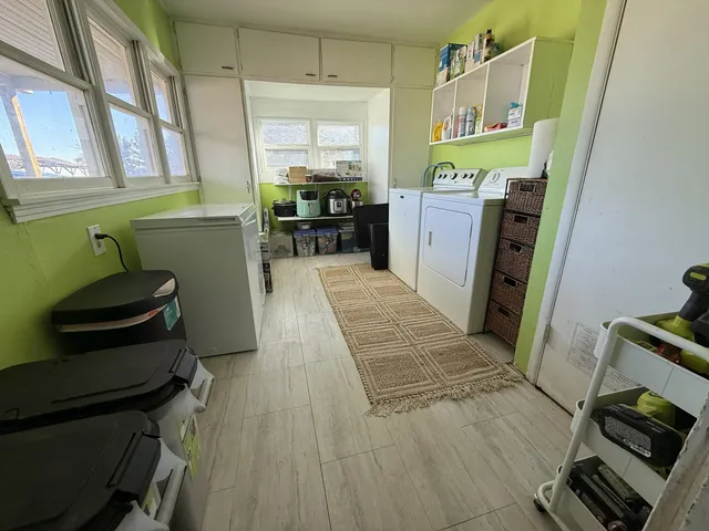 a room with wooden floor and furniture