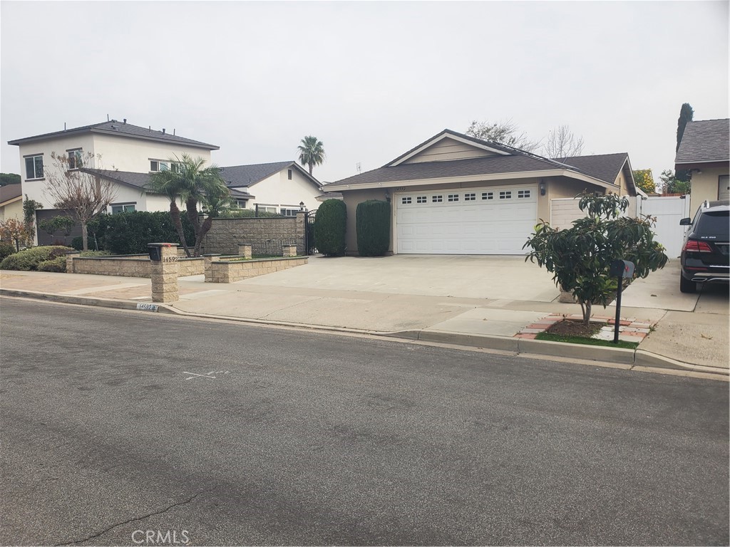 14592 Highcrest Circle Irvine, CA 92604 - Photo 1 of 1 a view of a house with a yard and potted plants