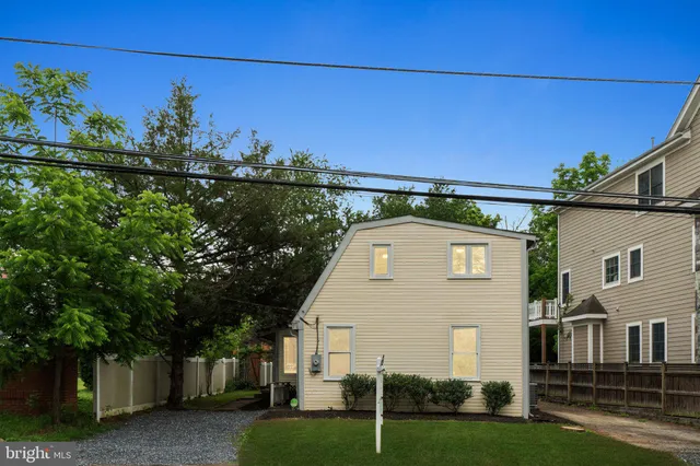 a aerial view of a house with a yard