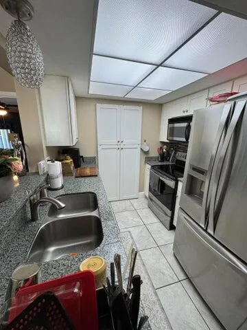 a kitchen with sink and stove