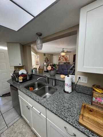 3290 Southeast Aster Lane, Unit D259 Stuart, FL 34994 - Photo 10 of 16 a kitchen with sink and stove