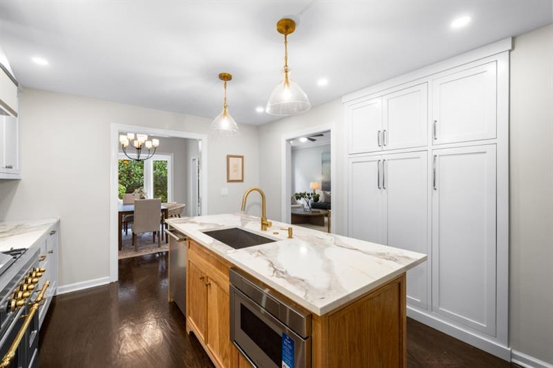 11 Mooregate Square Northwest Atlanta, GA 30327 - Photo 12 of 31 a kitchen that has a lot of counter space and wooden floor