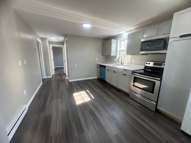 15-17 Otis Court, Unit 15 Springfield, MA 01119 - Photo 6 of 16 a kitchen with granite countertop stainless steel appliances cabinets a sink and a stove