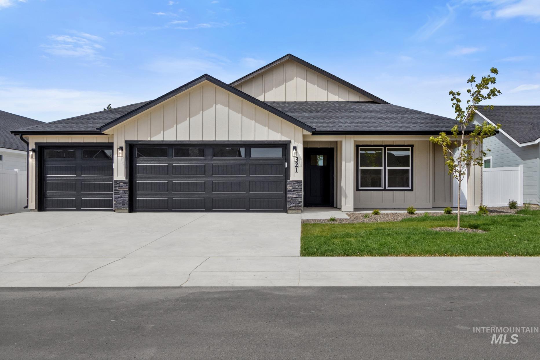 Modern ranch-style residence featuring a combination of vertical board and batten siding with horizontal siding