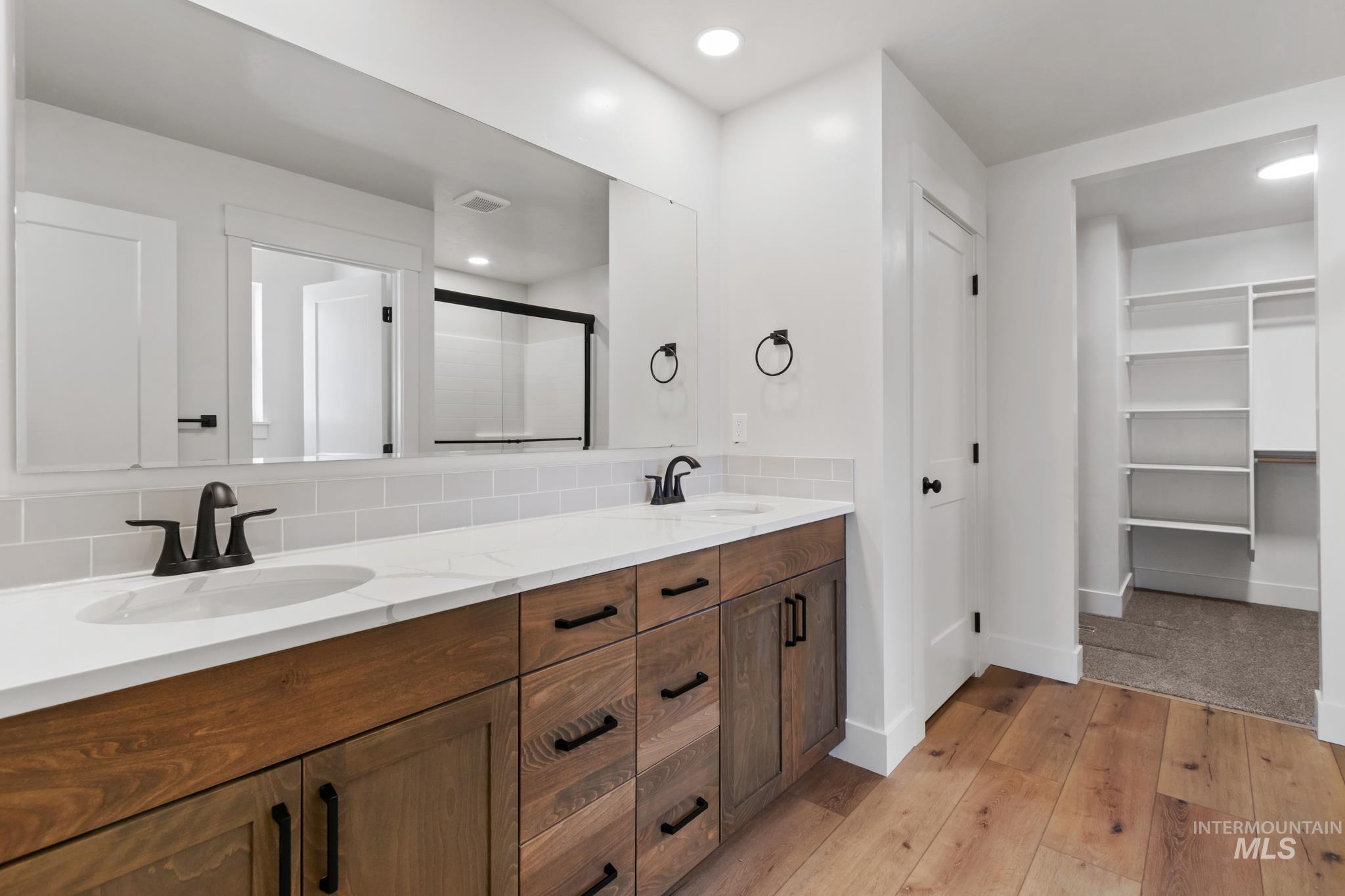 321 North 11th Street Parma, ID 83660 - Photo 26 of 36 Dual vanity with white countertops and integrated sinks