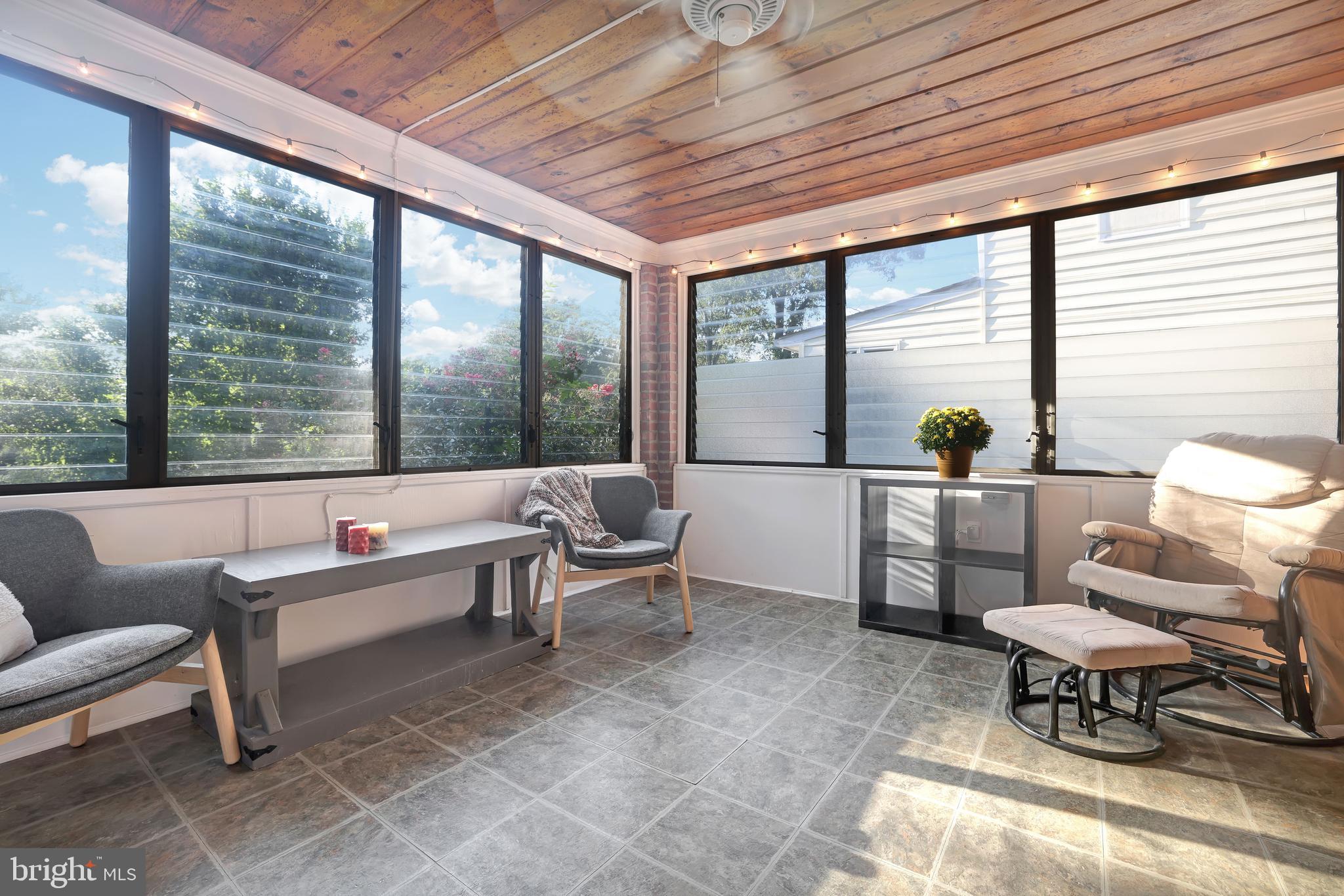 10700 Hayes Avenue Silver Spring, MD 20902 - Photo 12 of 38 Sun room with slatted windows and screens