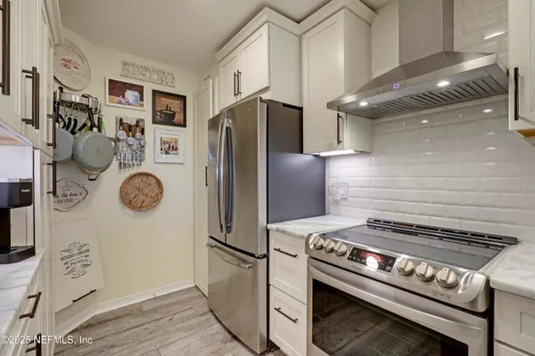 a kitchen with a stove and a sink