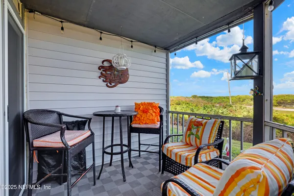 an aerial view of a house with garden space and street view