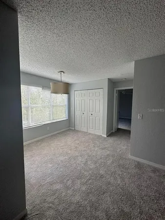 a view of an empty room with a window