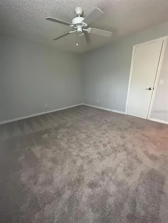 a view of a big room with carpet