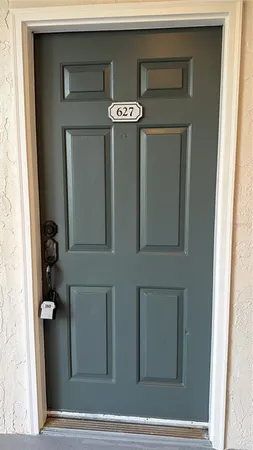 a room with a door and a mirror