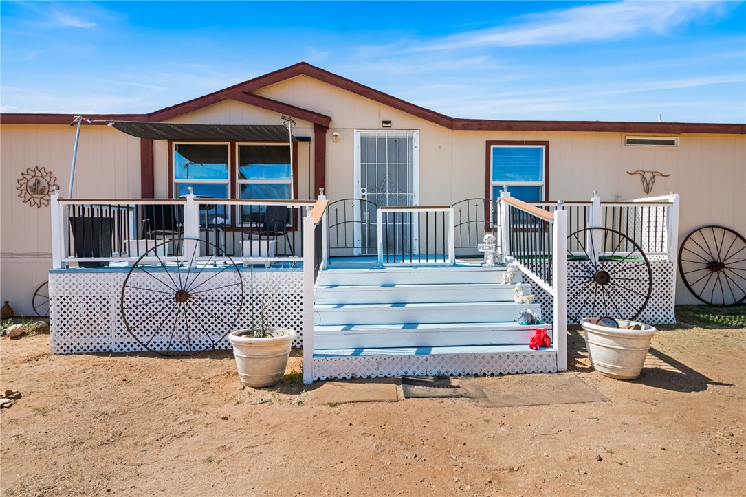 3411 Mayer Road Golden Valley, AZ 86413 - Photo 1 of 49 Back of house with a wooden deck
