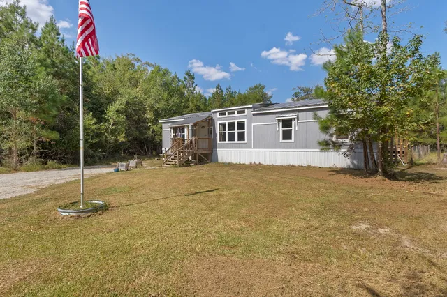 a house view with a backyard space