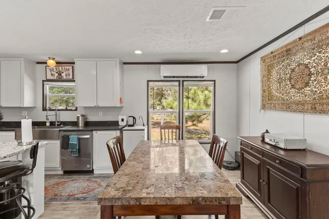 a kitchen with sink stove and cabinets