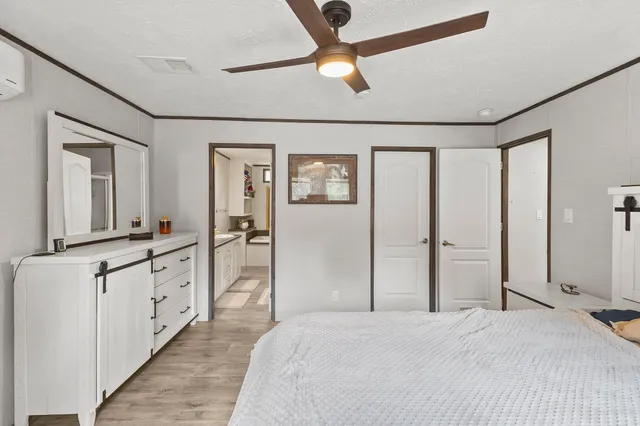 a spacious bathroom with a double vanity sink and a mirror