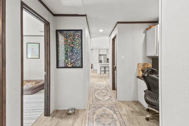 a view of a livingroom with wooden floor and closet