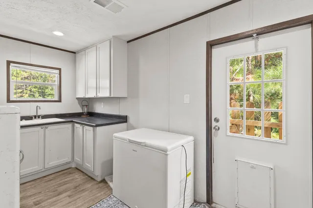 a view of a kitchen with appliances and cabinets