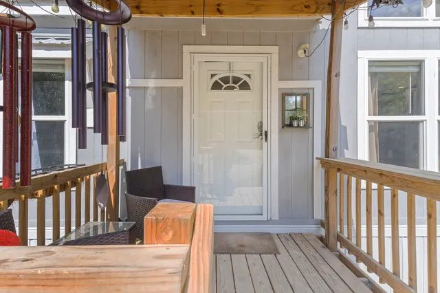 a view of a door and wooden floor