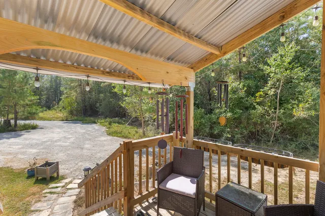 a view of a two chairs in the balcony