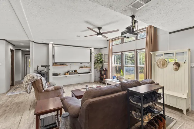 a living room with furniture and a window