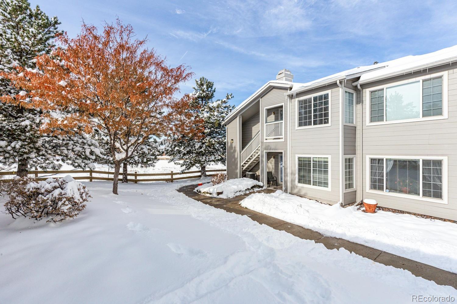 8425 Pebble Creek Way, Unit 104 Highlands Ranch, CO 80126 - Photo 16 of 16 a view of a house with backyard and sitting area