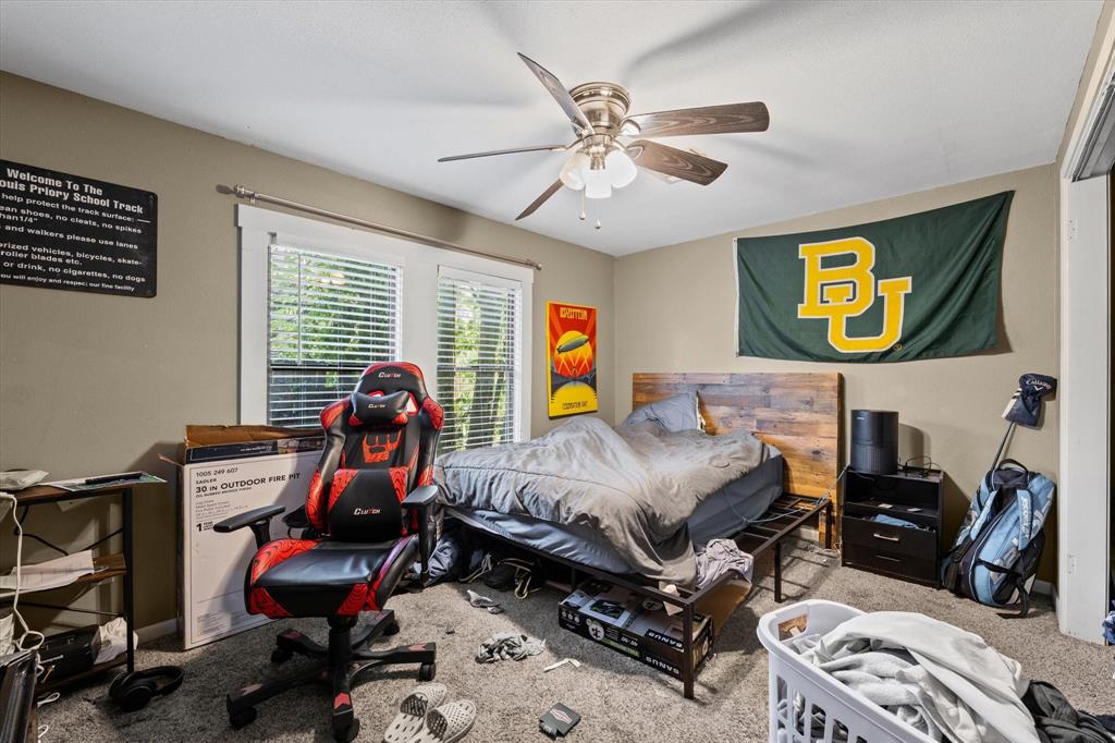 2007 South 7th Street Waco, TX 76706 - Photo 14 of 22 a bedroom with a bed and wooden floor