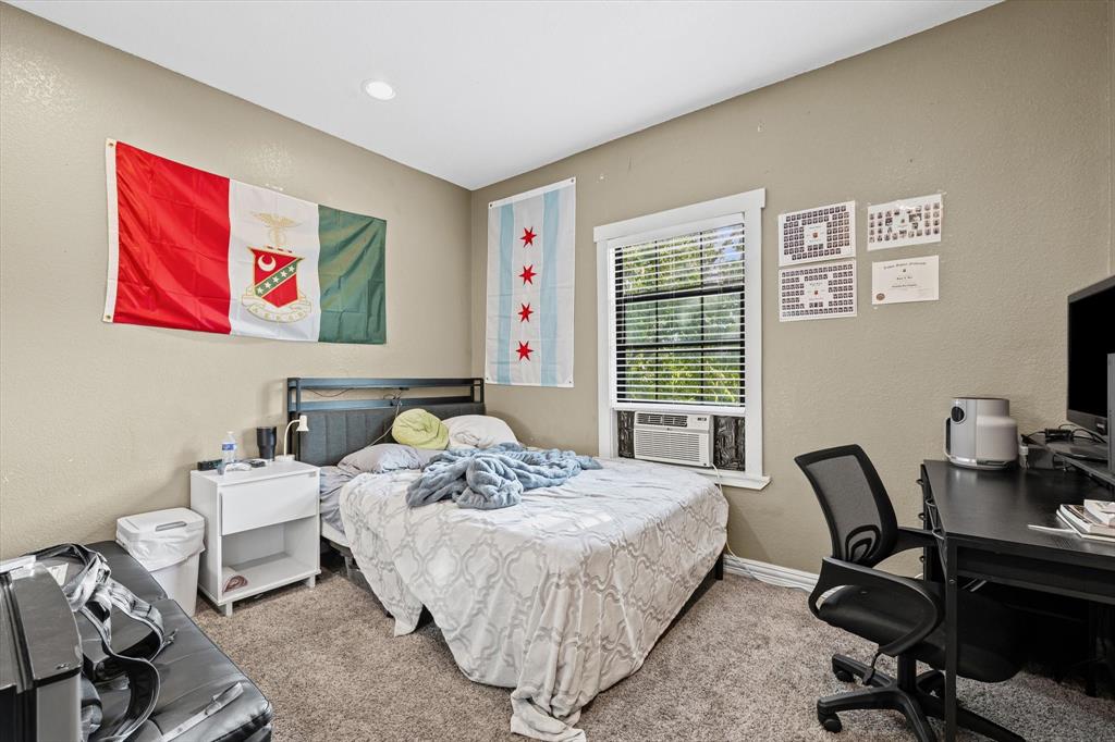 2007 South 7th Street Waco, TX 76706 - Photo 19 of 22 a bedroom with a bed and a desk