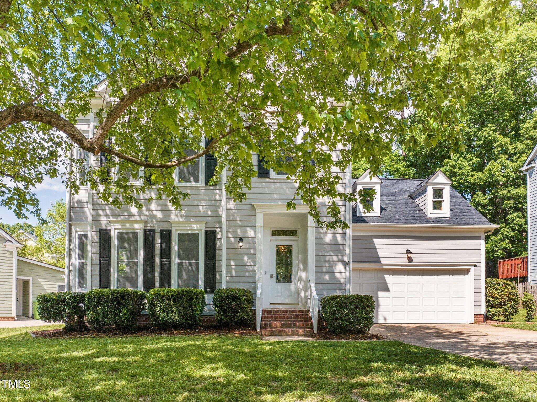 5236 Covington Bend Drive Raleigh, NC 27613 - Photo 48 of 49 a front view of a house with a yard and garage