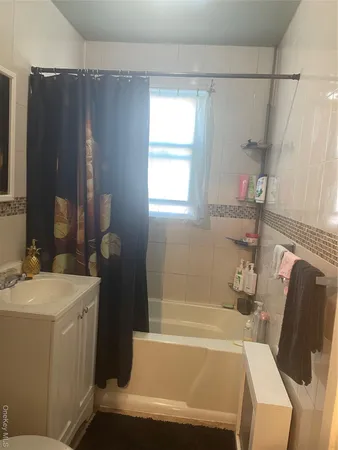 a view of a hallway with a livingroom