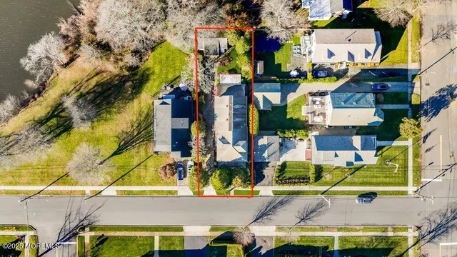 an aerial view of multiple houses with yard