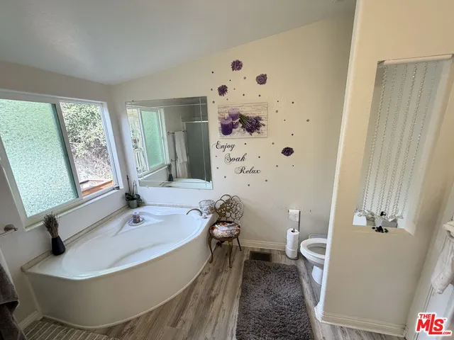 a bathroom with a bathtub and sink