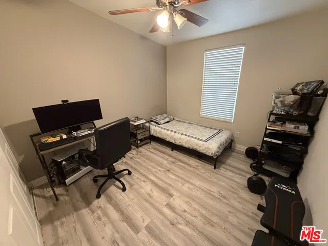 a bedroom with furniture and a window