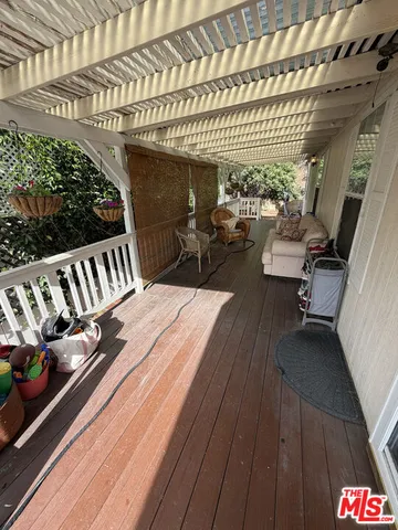 a view of a balcony with furniture