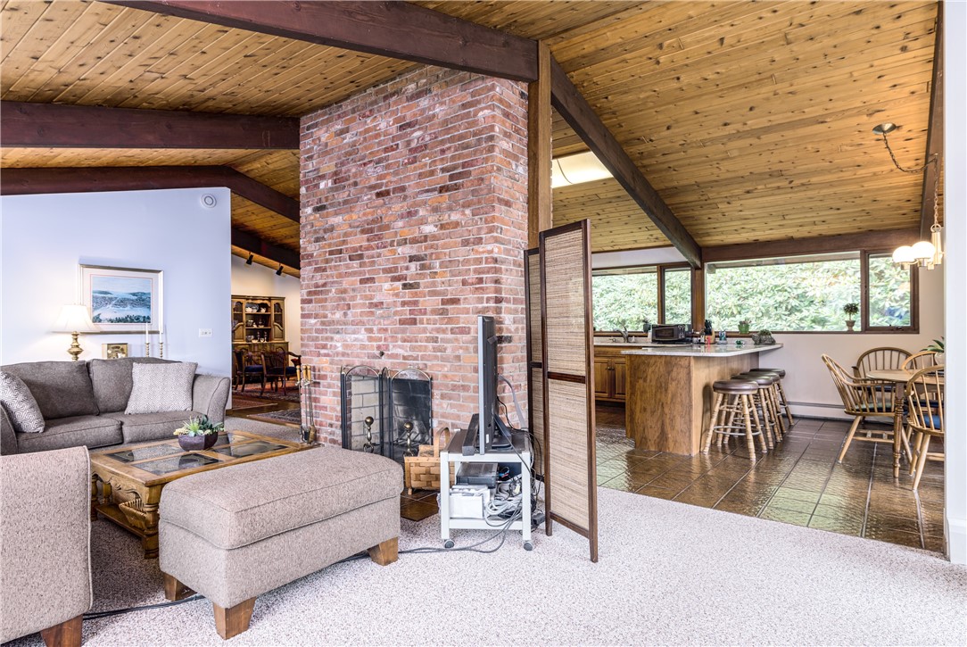 1950 Boston Neck Road North Kingstown, RI 02874 - Photo 23 of 42 Living room with kitchen and dining in the rear