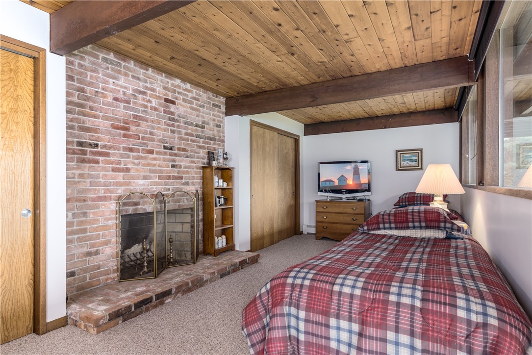 1950 Boston Neck Road North Kingstown, RI 02874 - Photo 33 of 42 Lower level bedroom with fireplace