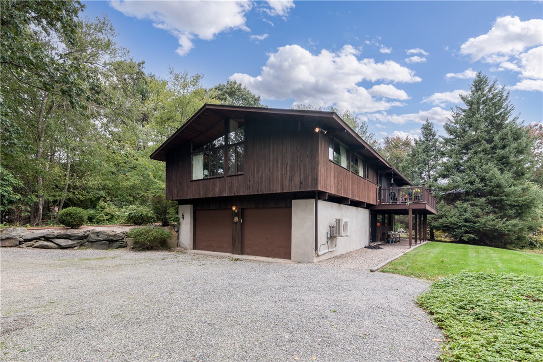 1950 Boston Neck Road North Kingstown, RI 02874 - Photo 6 of 42 Side showing the garage and back of the house.