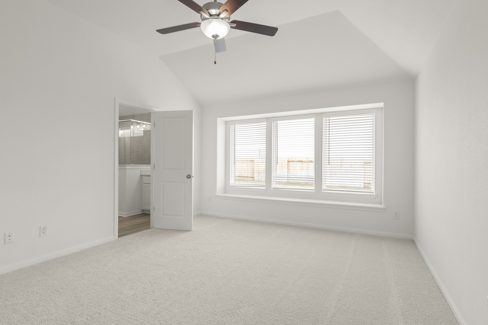3729 Pin Oak Hills Seguin, TX 78155 - Photo 14 of 22 Unfurnished bedroom with light carpet, lofted ceiling, ceiling fan, and ensuite bath