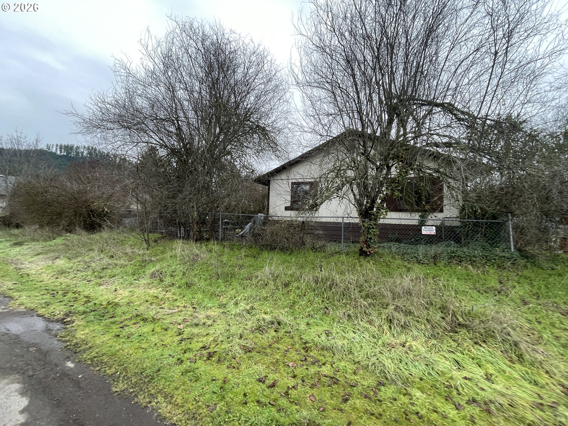 48433 Jasper Drive Oakridge, OR 97463 - Photo 2 of 6 a front view of a house with a yard