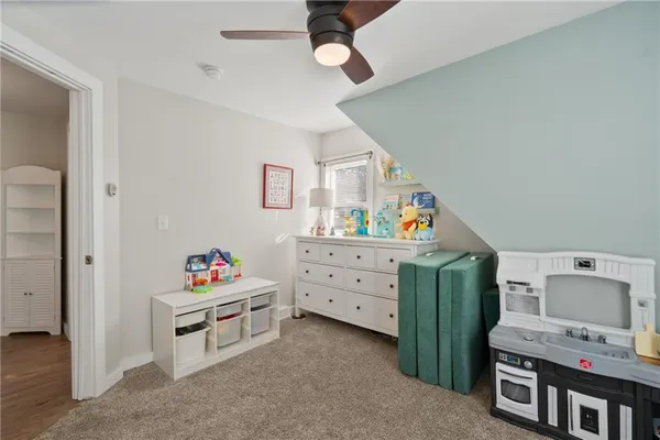 a bedroom with furniture and a window