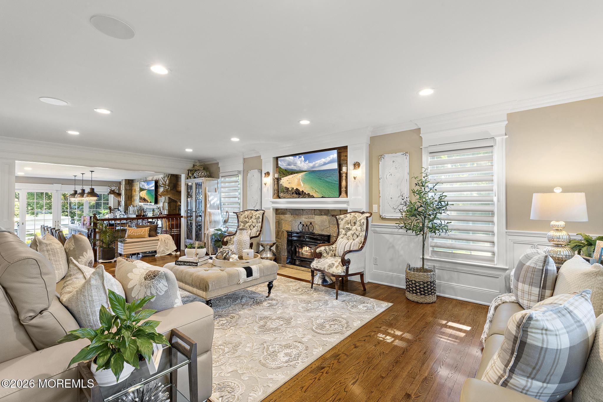 57 Beaver Dam Road Colts Neck, NJ 07722 - Photo 16 of 79 a living room with furniture fireplace and potted plant