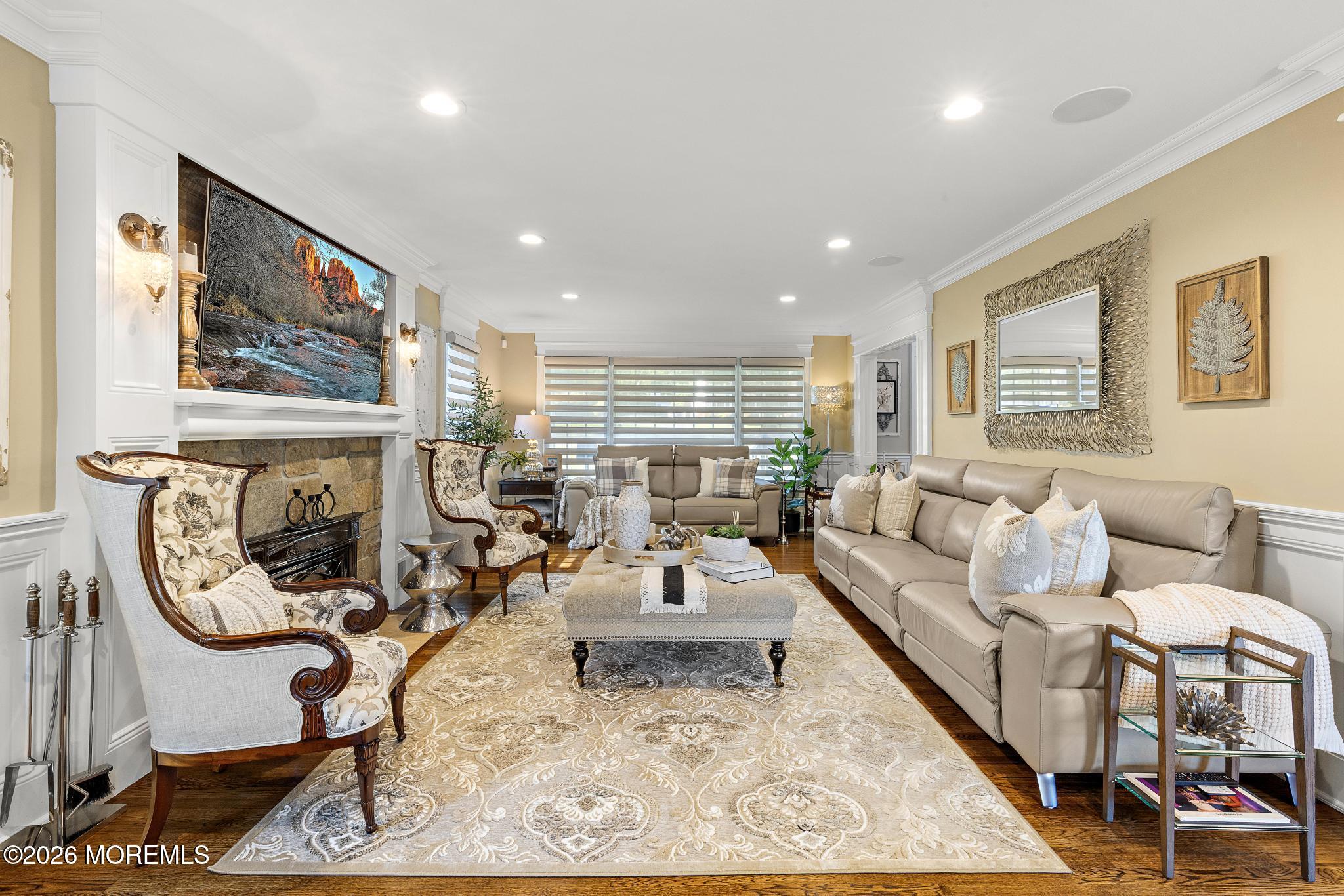 57 Beaver Dam Road Colts Neck, NJ 07722 - Photo 17 of 79 a living room with furniture a fireplace and a flat screen tv