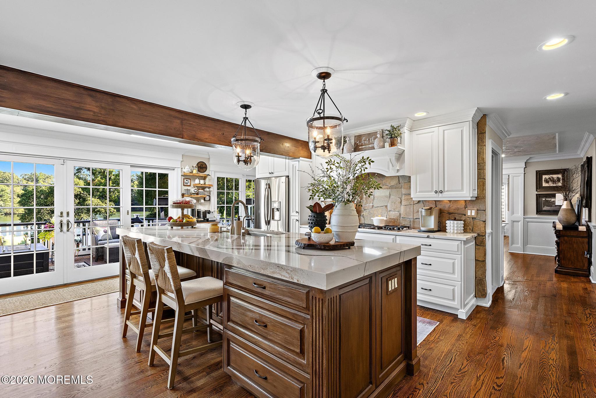 57 Beaver Dam Road Colts Neck, NJ 07722 - Photo 26 of 79 a kitchen with stainless steel appliances granite countertop a stove and a wooden floors